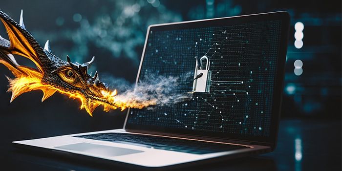 A dragon breathing fire at a padlock on a laptop screen, symbolising cybersecurity threats.