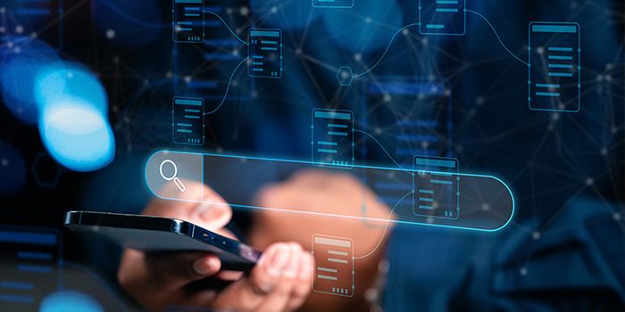 Hands using a smartphone with digital icons representing ERP implementation.