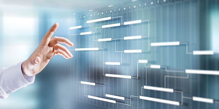 Hand interacting with a digital project management office (PMO) timeline or Gantt chart on a transparent screen.