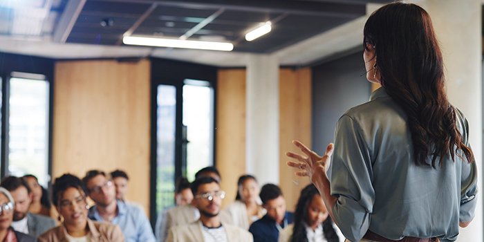 A woman communicating and training the workplace