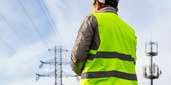 someone looking at power lines to show our energy customer